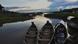 The Amazon river with four boats in the foreground The Amazon river with four boats in the foreground
