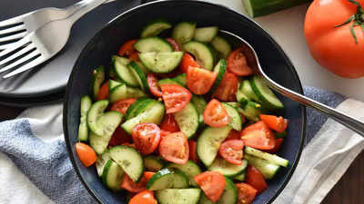 Why should you avoid mixing Tomato and Cucumber in salads?