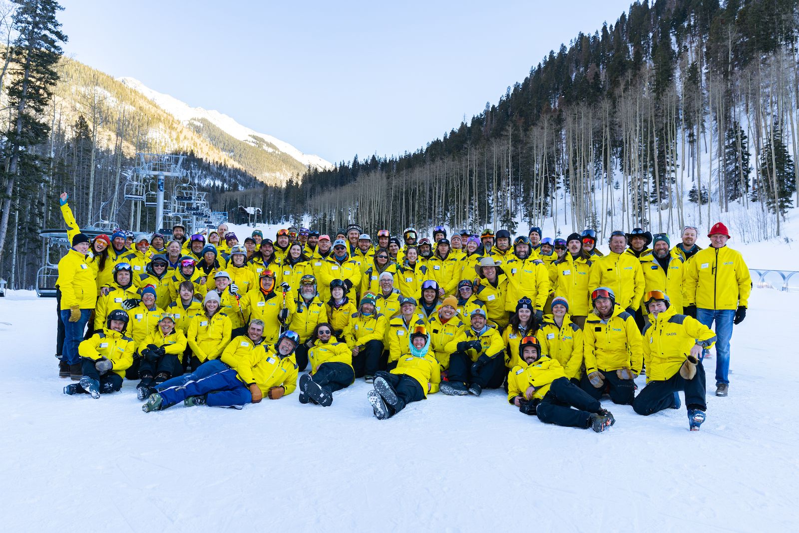 Group photo of the ski and snowboard coaches of the Ernie Blake Snowsports School in Taos