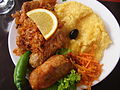 Image 10A popular Moldovan dish of sarmale (stuffed cabbage rolls), accompanied by sauerkraut and mămăligă (from Moldovan cuisine)