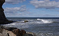 2014-03-23 Waves break on the cliffs by Staithes.