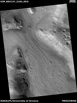 Lineated valley fill in valley, as seen by HiRISE under HiWish program. Linear valley flow is ice covered by debris.