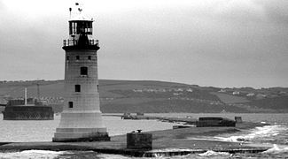 Plymouth breakwater from Kingsand, showing the 1844 lighthouse and the separate Breakwater Fort beyond