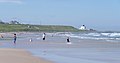 2014-12-16 People on the beach at Bamburgh.