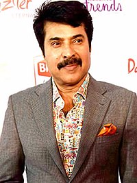 Mammootty wearing a suit, looking to one side