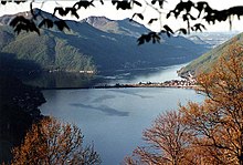 Lugano kun la akvobaraĵo de Melide, Svislando