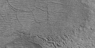 Cracked surface and low center polygons, as seen by HiRISE under HiWish program