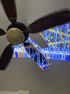 Projected piano waterfall on a running ceiling fan