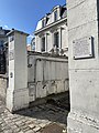 Plaque in Saint-Germain-en-Laye highlighting Émile Pereire's role in developing the Cité Médicis neighborhood above the new railway in 1837