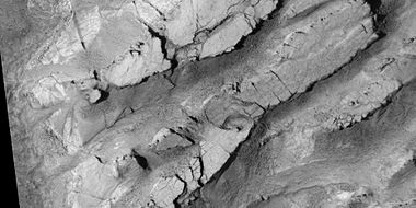 Mesas breaking up into blocks, as seen by HiRISE under HiWish program