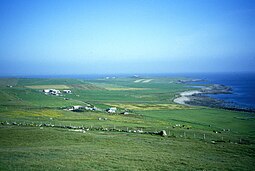 A view of the western side of the island, with West and East Kirbest in the foreground and Langskaill beyond