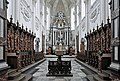 Image 8 Averbode Abbey Photograph credit: Marc Ryckaert Averbode Abbey is a Premonstratensian abbey in Averbode, in the municipality of Scherpenheuvel-Zichem, Belgium. The abbey was founded about 1134, suppressed in 1797, and re-established in 1834. The church is a synthesis of Baroque and Gothic architecture, with Renaissance ornamental details, and dominates the monastery complex; it was built between 1664 and 1672, to a design by the Antwerp architect Jan Van den Eynde II. This view of the church's interior shows the chancel, with the choir in the foreground and the sanctuary in the background. More selected pictures