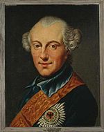 Painting of an almost-smiling man with a prominent widow's peak and his hair curled over the ears in late 1700s style. He wears a dark blue military uniform with a red sash and a large award on the breast of his coat.