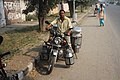 Delivering milk in India in reusable stainless steel containers