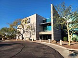 A two-story office building with ABC15 logo signage