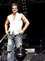 Image 4English-Australian singer Peter Andre in 2004 wearing ripped and sandblasted baggy jeans influenced by surfer and hip-hop fashion. (from 2000s in fashion)