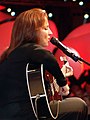 Gloria Estefan performs for the crew and their families during a special event to celebrate the United Through Reading program aboard the Nimitz class aircraft carrier USS Theodore Roosevelt (CVN-71). September 14, 2006.