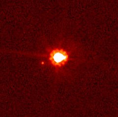 Eris (centre) and Dysnomia (left of centre), taken by the Hubble Space Telescope