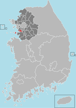 A region on an east coast is divided into 23 districts, with the southern coastal district highlighted.