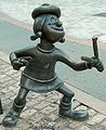 Image 14Statue of Minnie the Minx, a character from The Beano, in Dundee, Scotland. Launched in 1938, The Beano is known for its anarchic humour, with Dennis the Menace appearing on the cover. (from Culture of the United Kingdom)