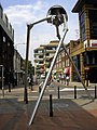 Image 65Statue of a tripod from The War of the Worlds in Woking, England, the hometown of author H. G. Wells. The book is a seminal depiction of a conflict between mankind and an extraterrestrial race. (from Culture of the United Kingdom)