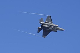 An F-35 Lightning II maneuvers during its first flight over Eglin Air Force Base, Fla., 2009.