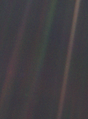 Image 2 Pale Blue Dot Photo credit: NASA/JPL Pale Blue Dot is the name given to this 1990 photo of Earth taken from Voyager 1 when its vantage point reached the edge of the Solar System, a distance of roughly 3.7 billion miles (6 billion kilometres). Earth can be seen as a blueish-white speck approximately halfway down the brown band to the right. The light band over Earth is an artifact of sunlight scattering in the camera's lens, resulting from the small angle between Earth and the Sun. Carl Sagan came up with the idea of turning the spacecraft around to take a composite image of the Solar System. Six years later, he reflected, "All of human history has happened on that tiny pixel, which is our only home." More selected pictures