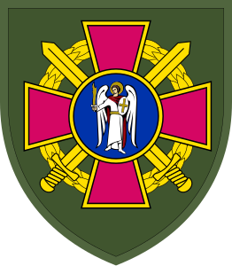 Arm badge of the Kyiv City Territorial Center of Procurement and Social Support, with an angel in front of two crossed swords on a dark green backdrop