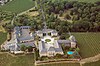 Aerial view from the south on Schloss Johannisberg in vineyards and park, Basilika and East Wing to the right