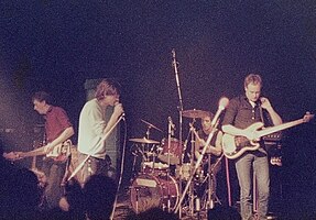 The Fall, Perverted by Language Tour in Hamburg, Germany (Markthalle), April 1984; L–R: Craig Scanlon, Mark E. Smith, Karl Burns, and Steve Hanley