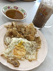 โรตี(Lo-ti)指印度煎餅roti canai，成為普吉人的早午茶