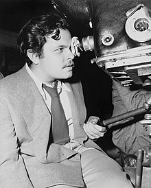 A young Orson Welles behind a camera