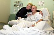 Roberts poses with Private 1st Class Sowell, a patient at the Incirlik hospital (7 December 2001)