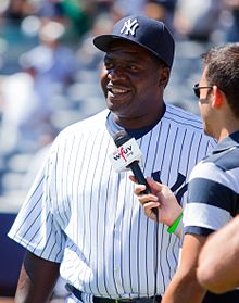 Hayes being interviewed in New York Yankee uniform