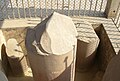 The base of the Ashoka pillar in Sarnath which was broken during Turk Islamic invasions, it was originally surmounted by the "Lion Capital of Ashoka" which is presently on display at the Sarnath Museum. This particular Lion Capital of Ashoka, originally atop this pillar in Sarnath, has been adopted as the "National Emblem of India".