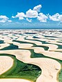 Image 3 Lençóis Maranhenses National Park Photograph: Julius Dadalti Lençóis Maranhenses National Park (Parque Nacional dos Lençóis Maranhenses) is a national park located in Maranhão state, in northeastern Brazil, just east of the Baía de São José. Protected since June 1981, the 383,000-acre (155,000 ha) park includes 70 km (43 mi) of coastline, and an interior of rolling sand dunes. During the rainy season, the valleys among the dunes fill with freshwater lagoons, prevented from draining due to the impermeable rock beneath. The park is home to a range of species, including four listed as endangered, and has become a popular destination for ecotourists. More selected pictures