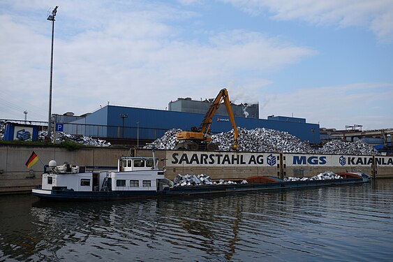 Barge on Saar river delivers sheet metal pressed into cubes for recycling by Saarstahl