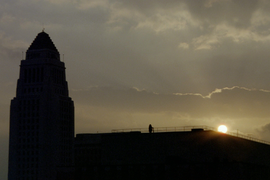 The silhouette of City Hall at sunrise