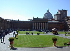 Pine Court Yard in the Vatican Museums with the cupola of St. Peter's Basilica