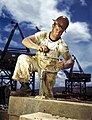 Carpenter using a hand-powered brace to drill a hole