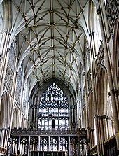 This interior view at York shows the Gothic style becoming less about projecting forms and more about surface treatment. The walls, vault and east window are all covered with a decorative net-like tracery. The pattern of the vault ribs resembles interconnecting stars.