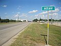 Beyond the Altair sign on US 90A is the Highway 71 junction and the rice dryer, Kallina Dryer Inc. The view is east.