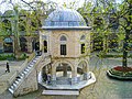 The courtyard of the Koza Han (1490–91) of Bursa, Turkey; the domed building is a small mosque (mescit)