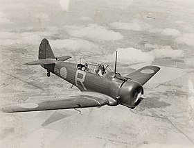 Single-engined two-seat military monoplane in flight, three-quarters overhead