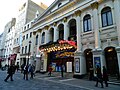 Image 9Music hall evolved into variety shows. First performed in 1912, the Royal Variety Performance was first held at the London Palladium (pictured) in 1941. Performed in front of members of the Royal Family, it is held annually in December and broadcast on television. (from Culture of the United Kingdom)