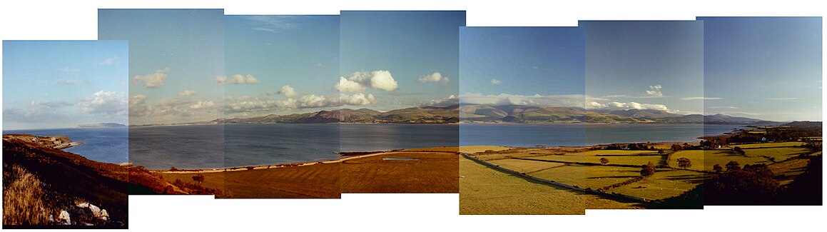 Panorama from Pendament old Deer Park across the Menai Strait with Snowdome in the background.