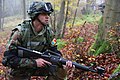 Image 3A soldier from Moldova pulls security while conducting a company situational training exercise during exercise Combined Resolve III at the Joint Multinational Readiness Center in Hohenfels, Germany, Oct. 26, 2014