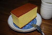 Castella cake, a Japanese variety of sponge cake of Portuguese origin. Castella was first cooked in the 16th century, and is based on Portuguese sponge cake recipes that were exchanged when the two nations commenced trade with each other.