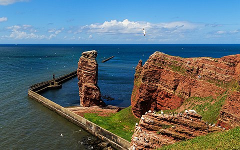 Heligoland / North Sea of Germany. View from the upper island to the cliffs (left: "Lange Anna" / lower right: "Lummenfelsen")