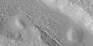 Hollows in surface, formed as ice is removed from ground, as seen by HiRISE under HiWish program